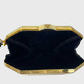 MCM Clutch aus Metall in Gold